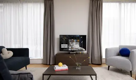 a living room with a television and a coffee table