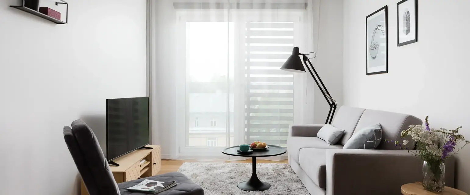 a living room with a couch and a tv