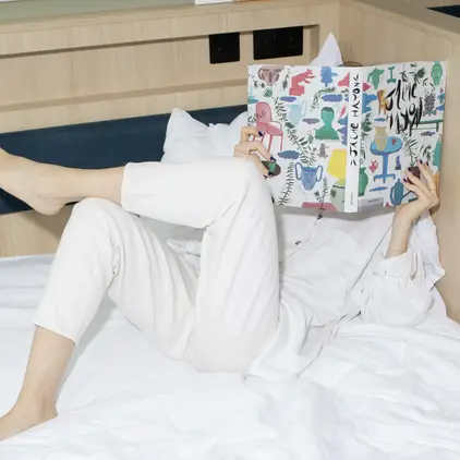 Image of lounging on a bed