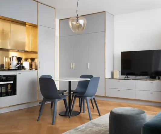 a room with a table and chairs