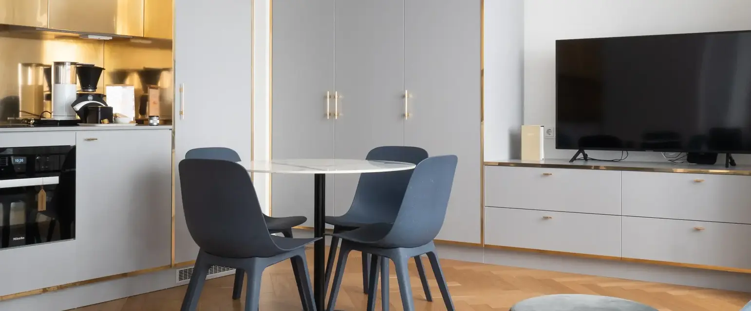 a room with a table and chairs