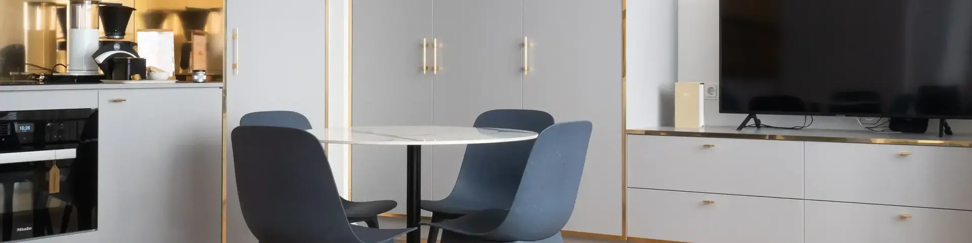 a room with a table and chairs