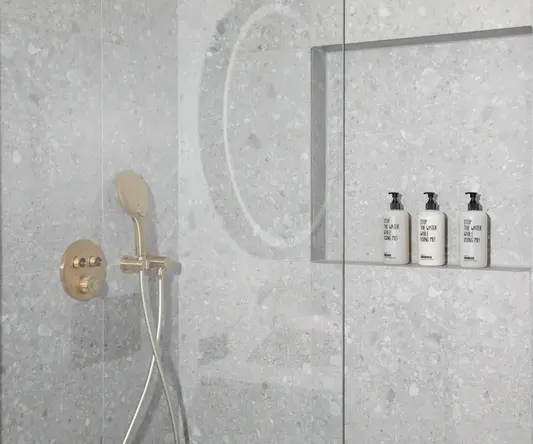 a shower with a shower head and shower head