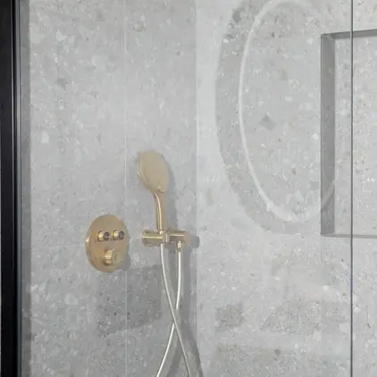 a shower with a shower head and shower head