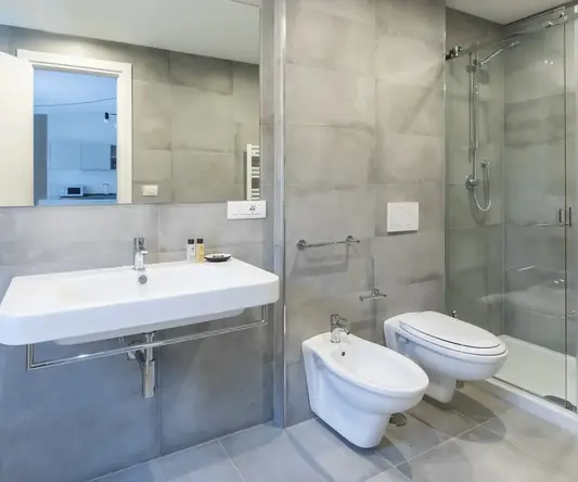 a bathroom with a shower and sink