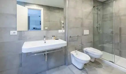 a bathroom with a shower and sink