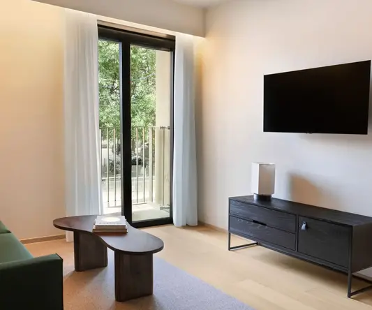 a living room with a television and a couch