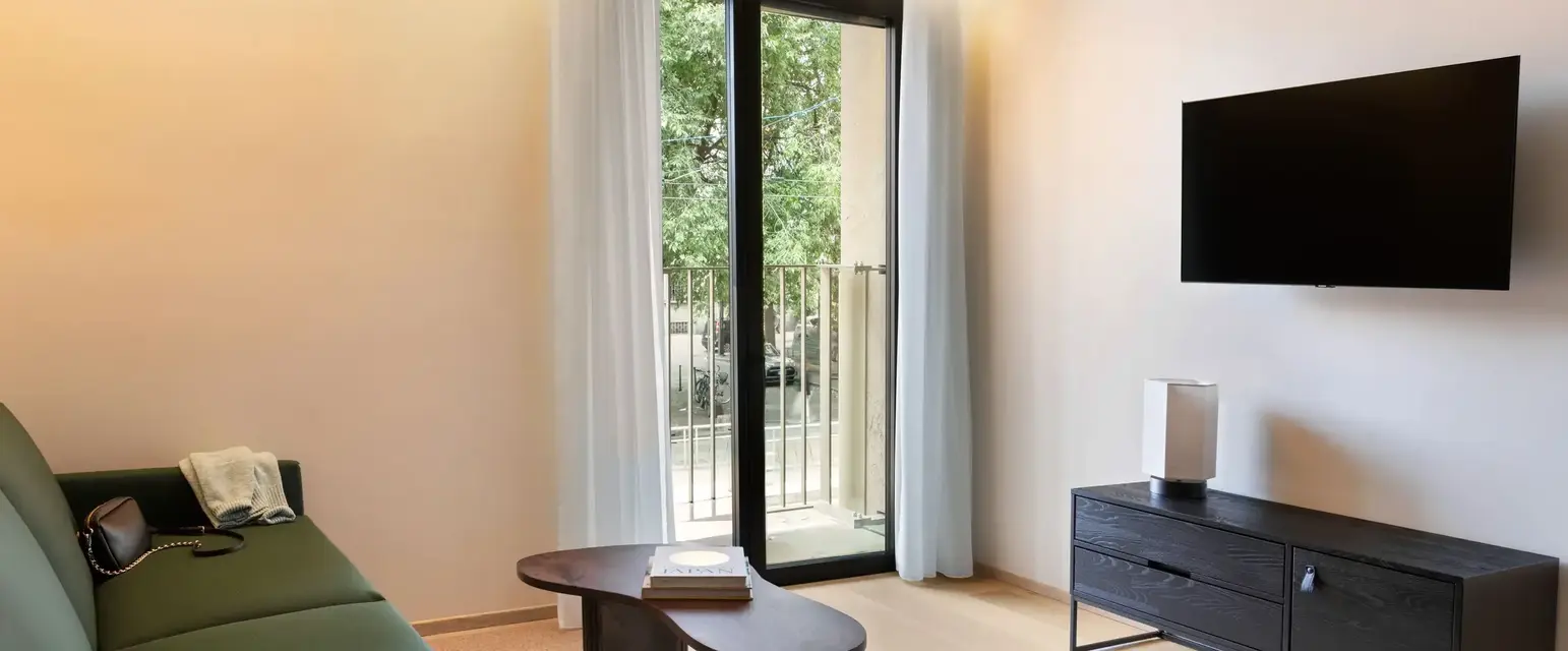 a living room with a television and a couch