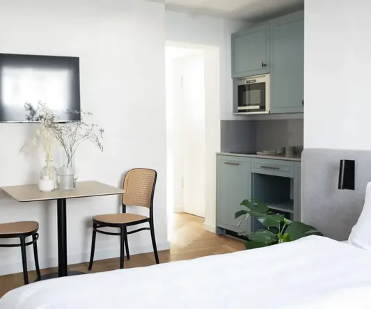 a room with a table and chairs