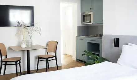 a room with a table and chairs