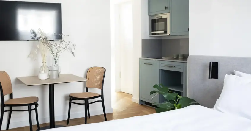 a room with a table and chairs