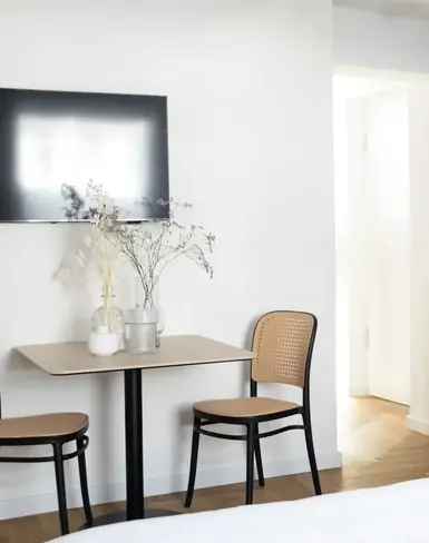 a room with a table and chairs