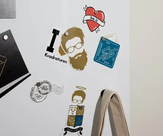 a white board with magnets and stickers