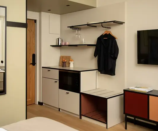 a room with a black shirt on a swinger