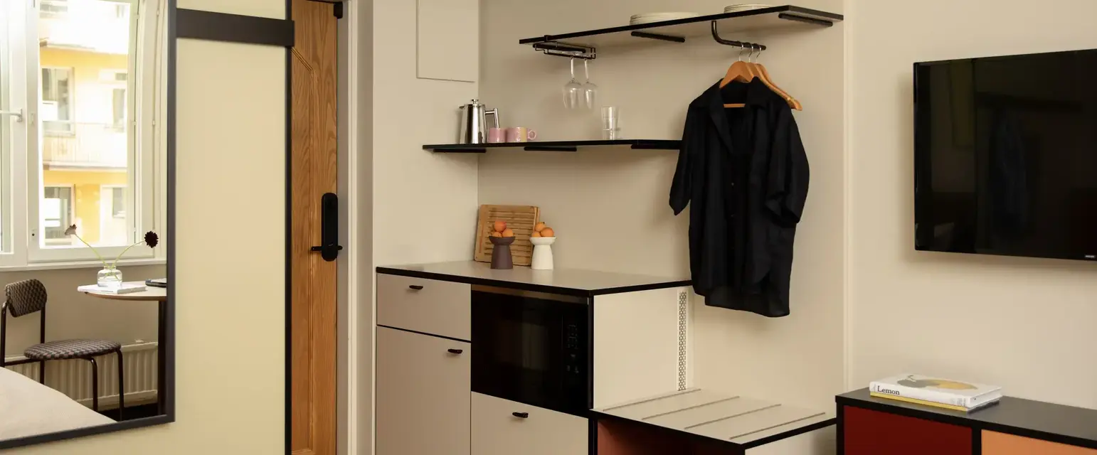 a room with a black shirt on a swinger