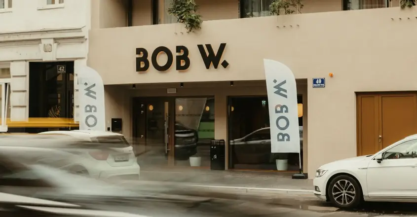 a building with cars parked in front of it