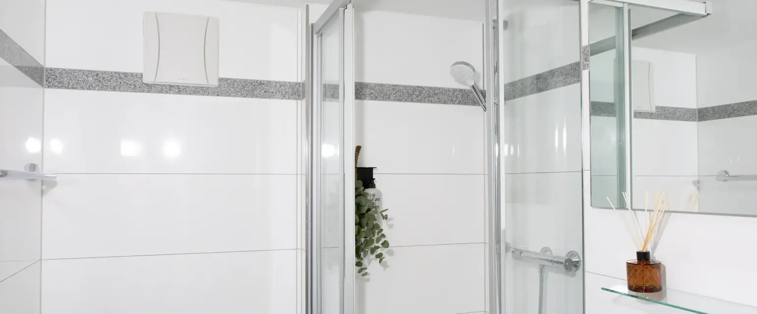 a shower with a glass door