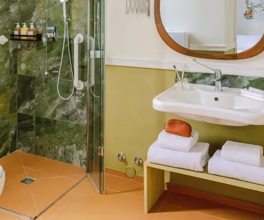 a bathroom with a mirror and sink