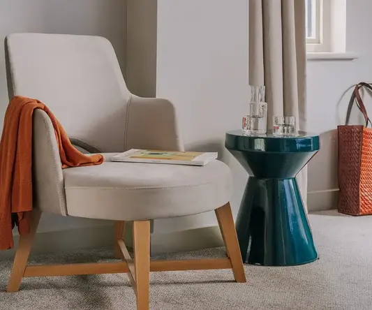 a chair next to a table