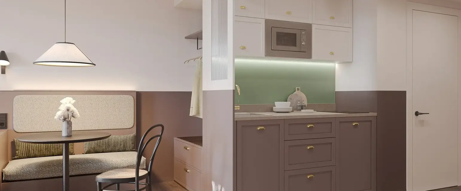 a kitchen with a chair and a table