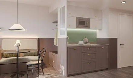 a kitchen with a chair and a table