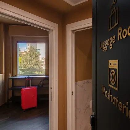 a door with a red suitcase in the background