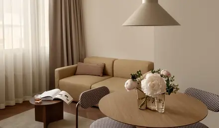 a living room with a couch and a table