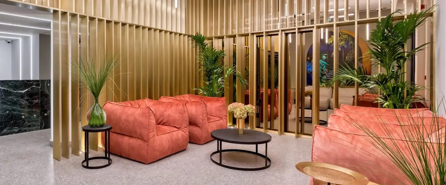 a room with a couch and tables