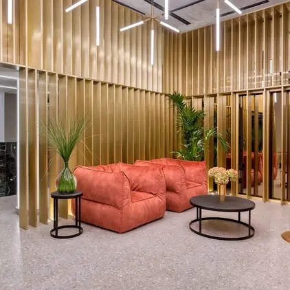 a room with a couch and tables