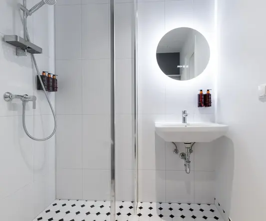 a bathroom with a mirror and a sink