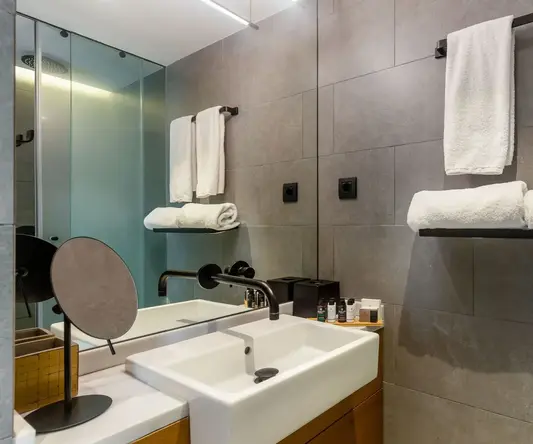 a bathroom with a sink and towels
