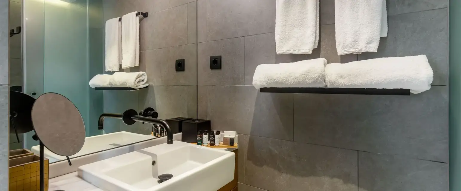 a bathroom with a sink and towels