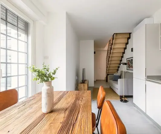 a room with a table and chairs