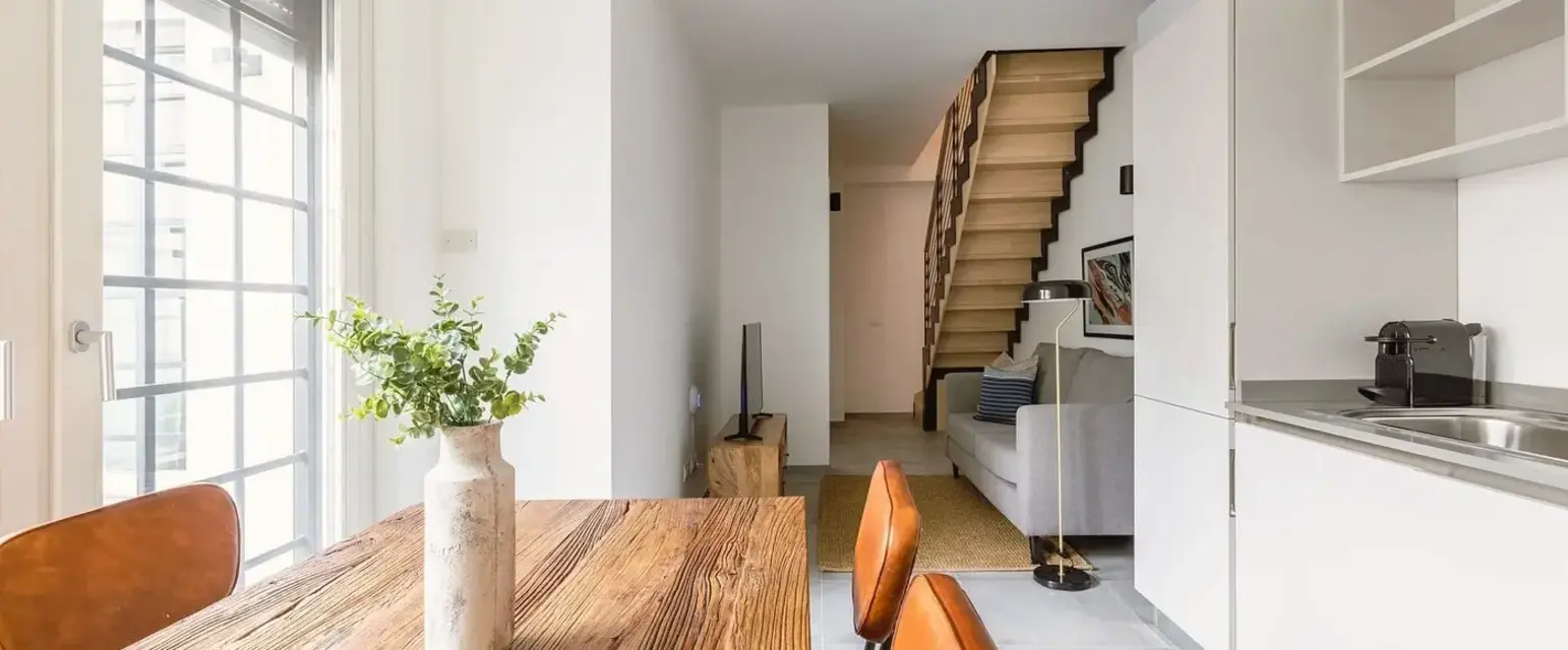 a room with a table and chairs