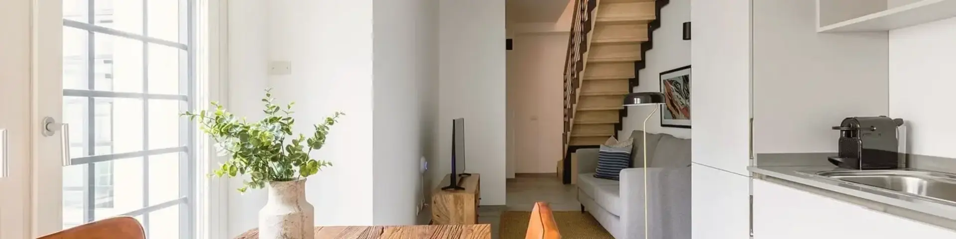 a room with a table and chairs