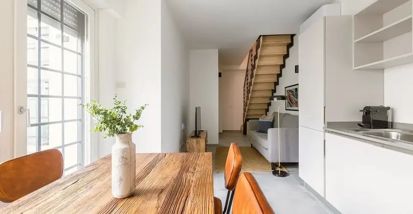 a room with a table and chairs