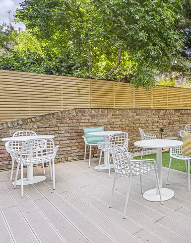 a patio with chairs and tables