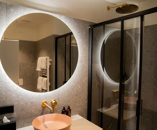 a bathroom with a shower and sink