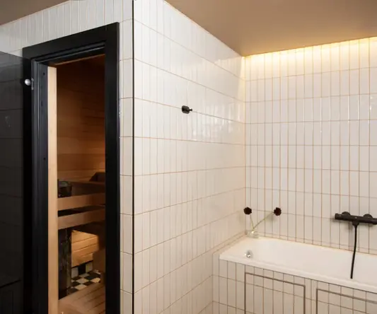 a bathroom with a bathtub and a tub