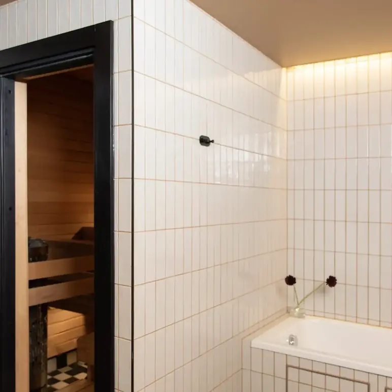 a bathroom with a bathtub and a tub