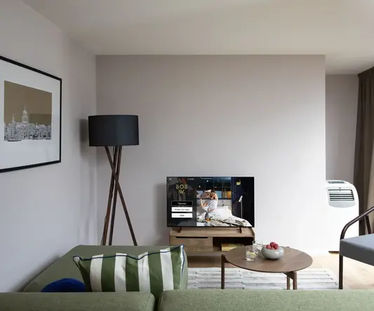 a living room with a television and a couch