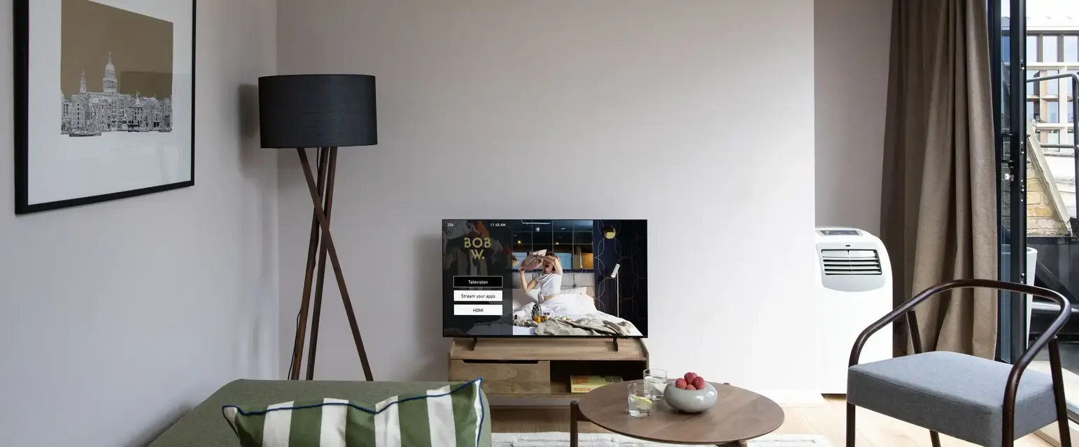 a living room with a television and a couch