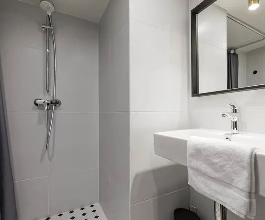 a bathroom with a shower and sink