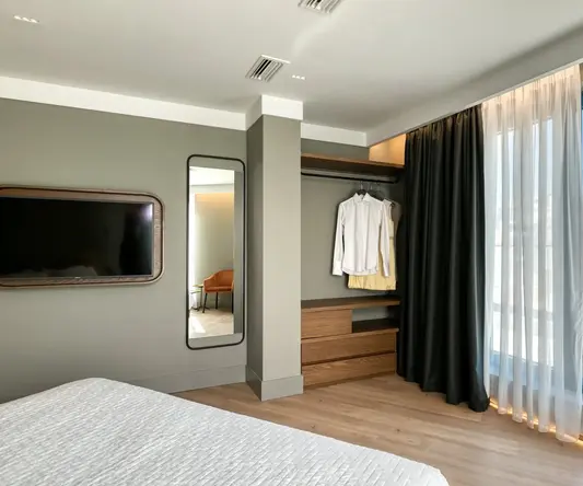 a room with a tv and a bed