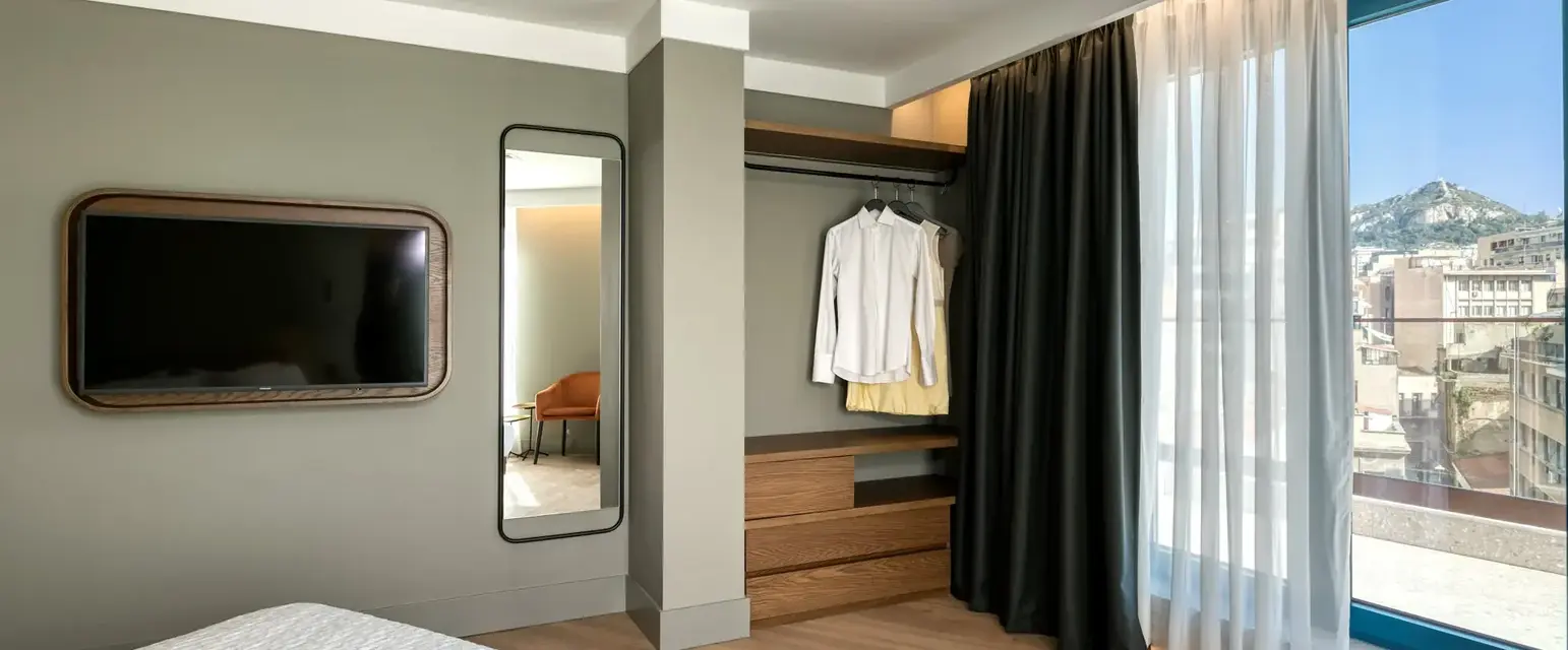 a room with a tv and a bed