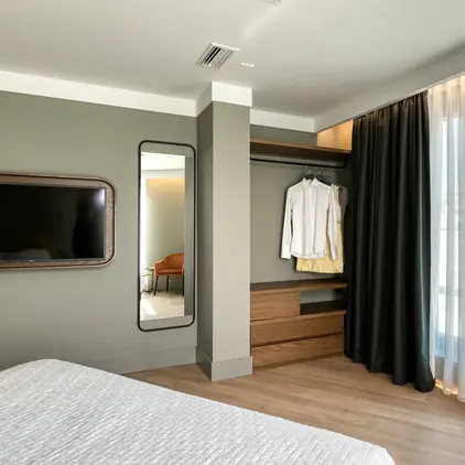 a room with a tv and a bed