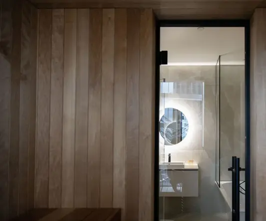 a bathroom with a glass door