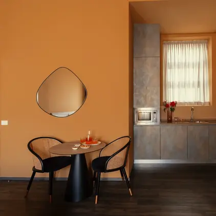 a kitchen with a table and chairs