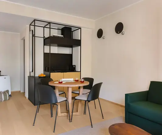 a room with a table and chairs