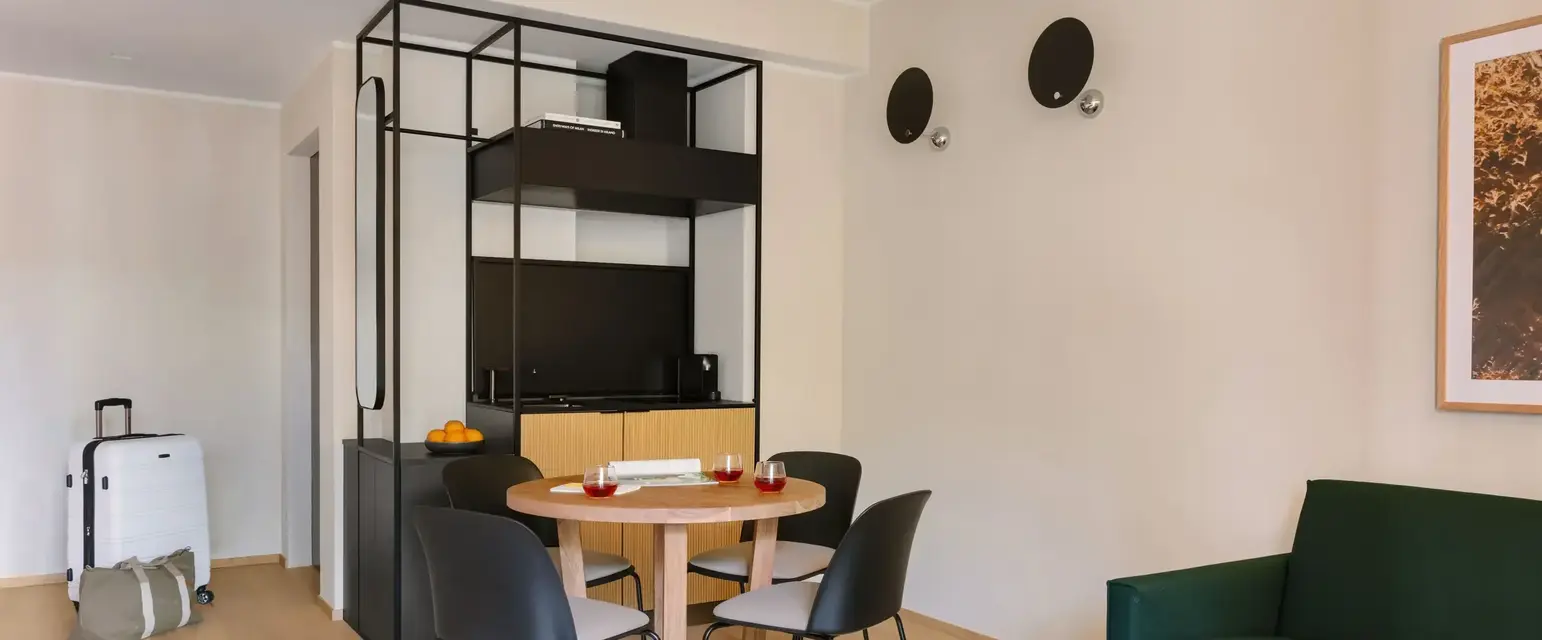 a room with a table and chairs